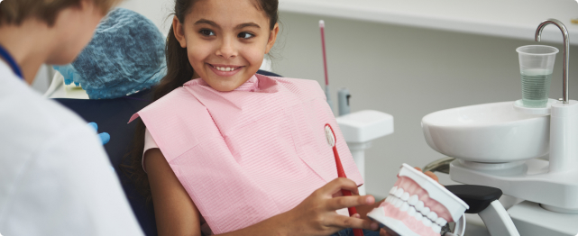 smiling child given children's dentistry service