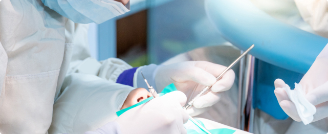 dentist performing emergency dentistry service on patient