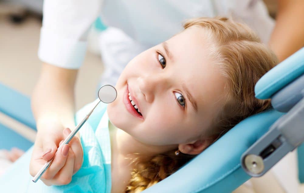 little girl at dental clinic