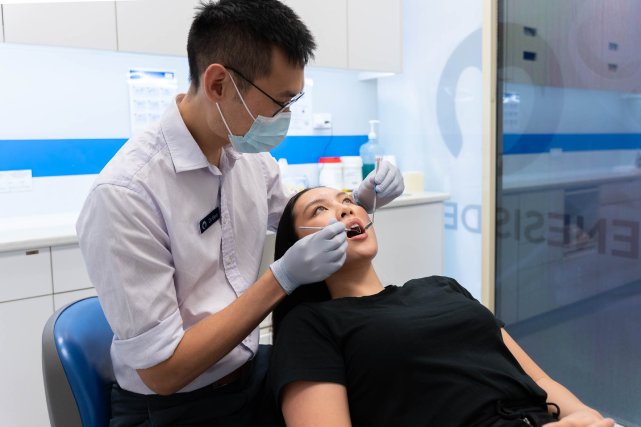 Dentist providing patient with a general dental checkup