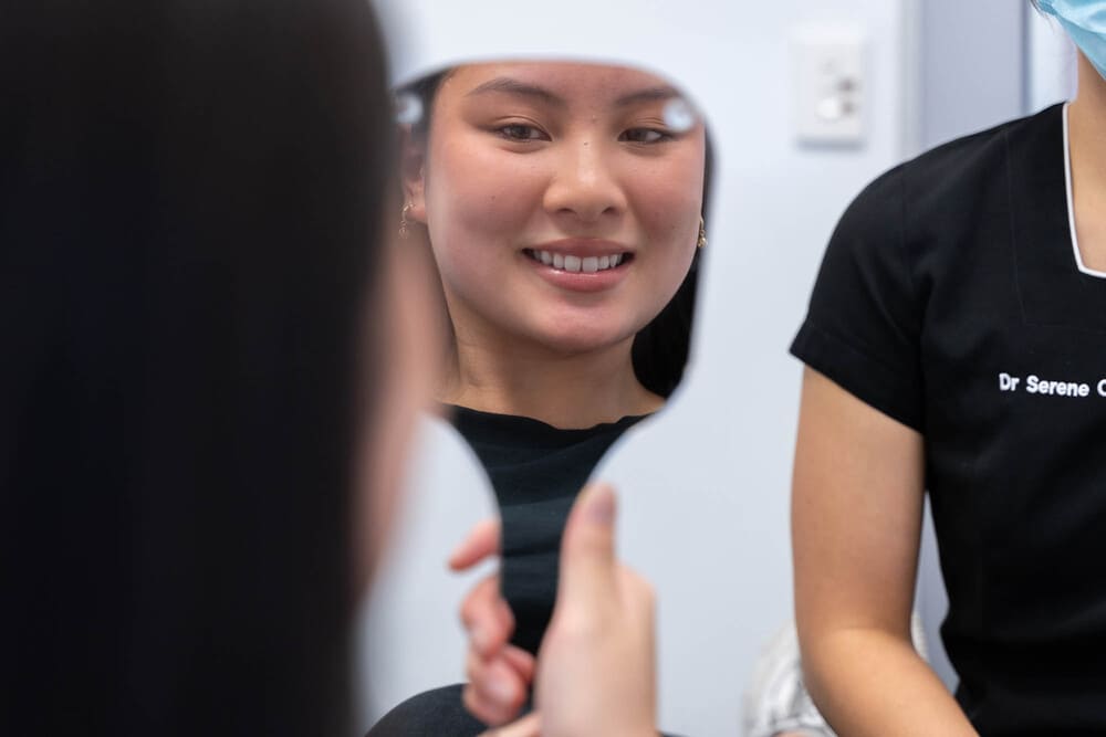 Person wearing clear aligners