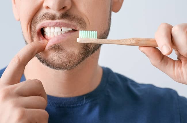 Hard brushing of your teeth can wear and abrade your enamel and cause damage to the gums.