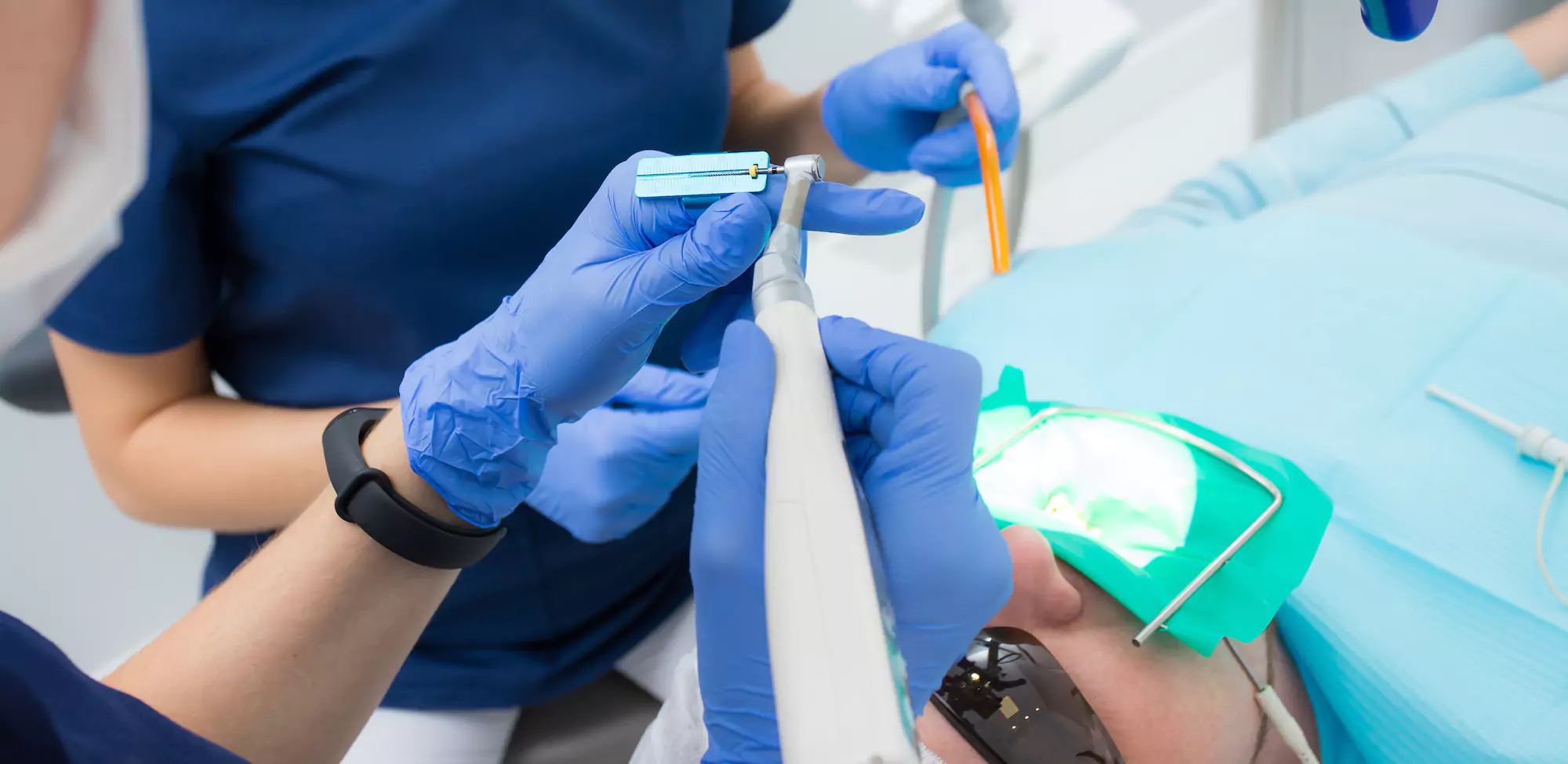 Dentists conducting a root canal treatment