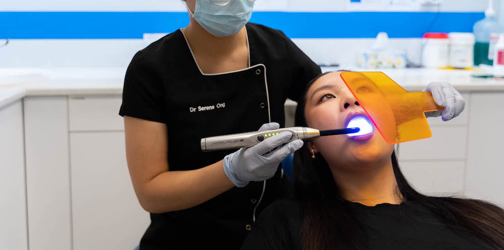 Serene performing teeth whitening