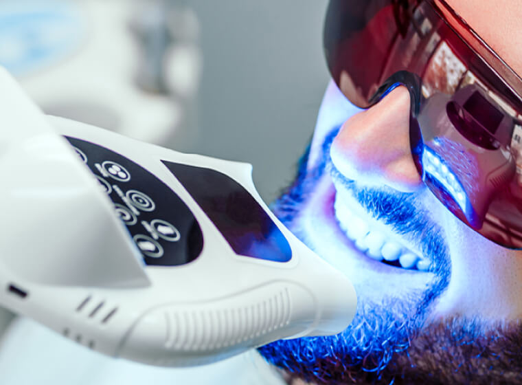 Man during a teeth whitening appointment