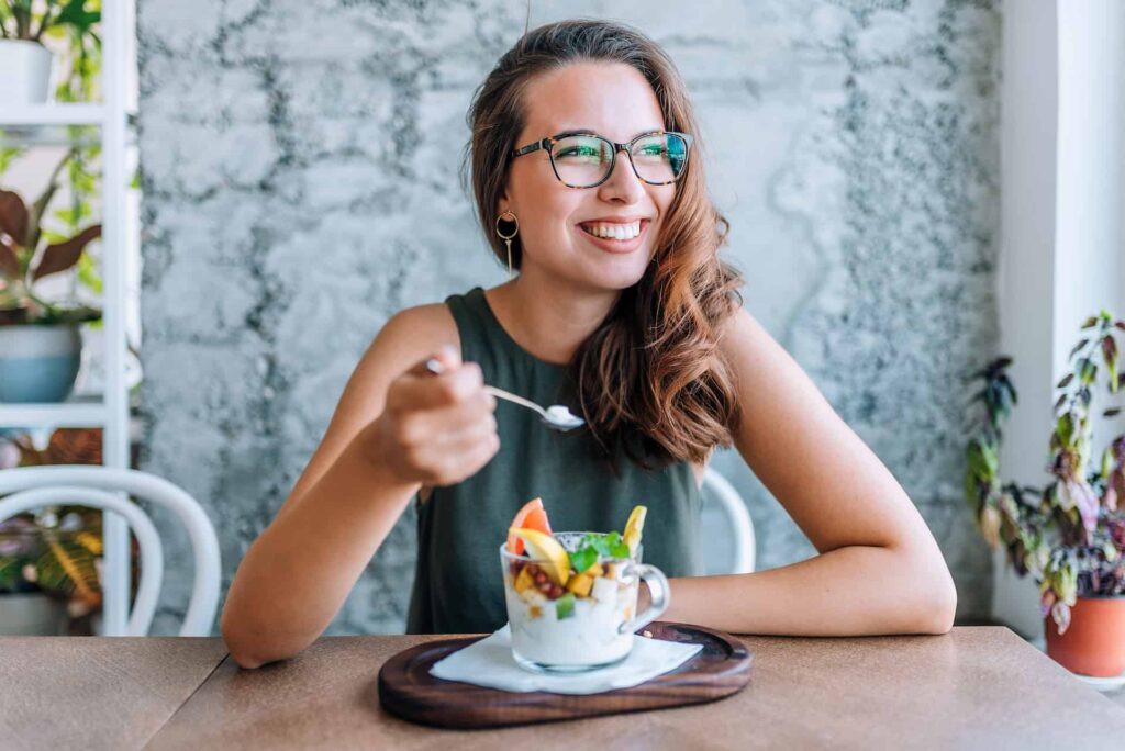 Woman utilising healthy diet on how to manage canker sores