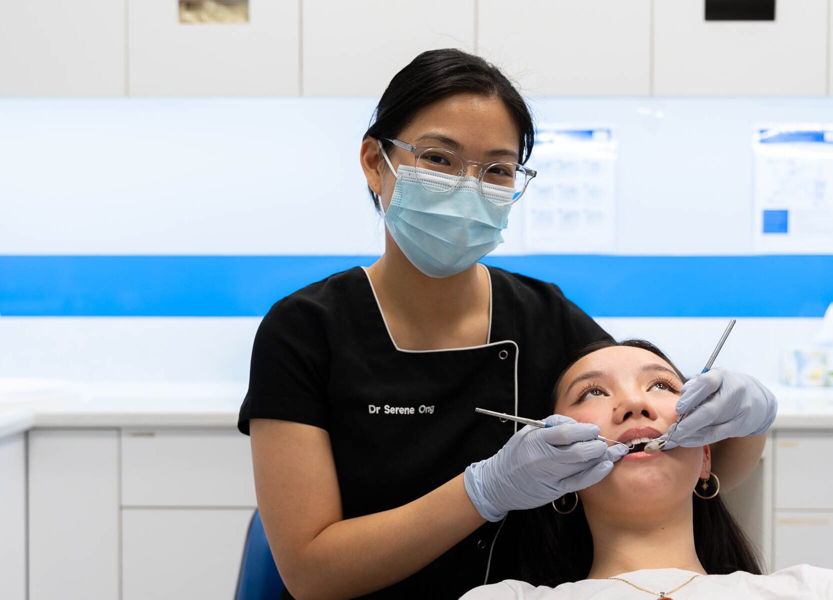 Dr Serene Ong conducting Wisdoom teeth removal on patient